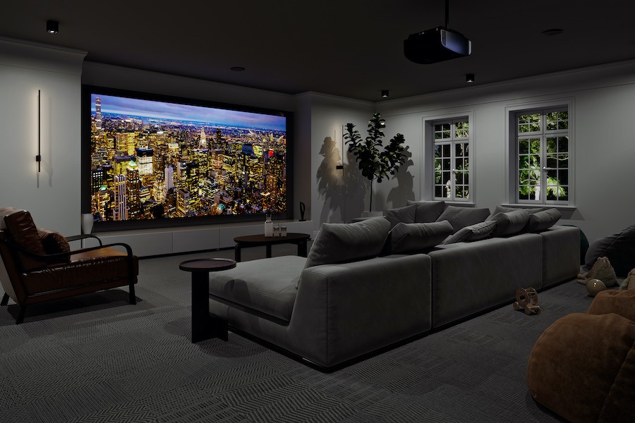 home theater with gray couches, sony projector and projection screen displaying cityscape.