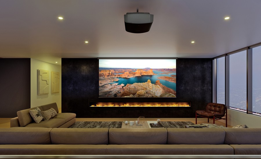 Ceiling-mounted Sony projector projects a high-resolution nature scene on a screen in a home theater room